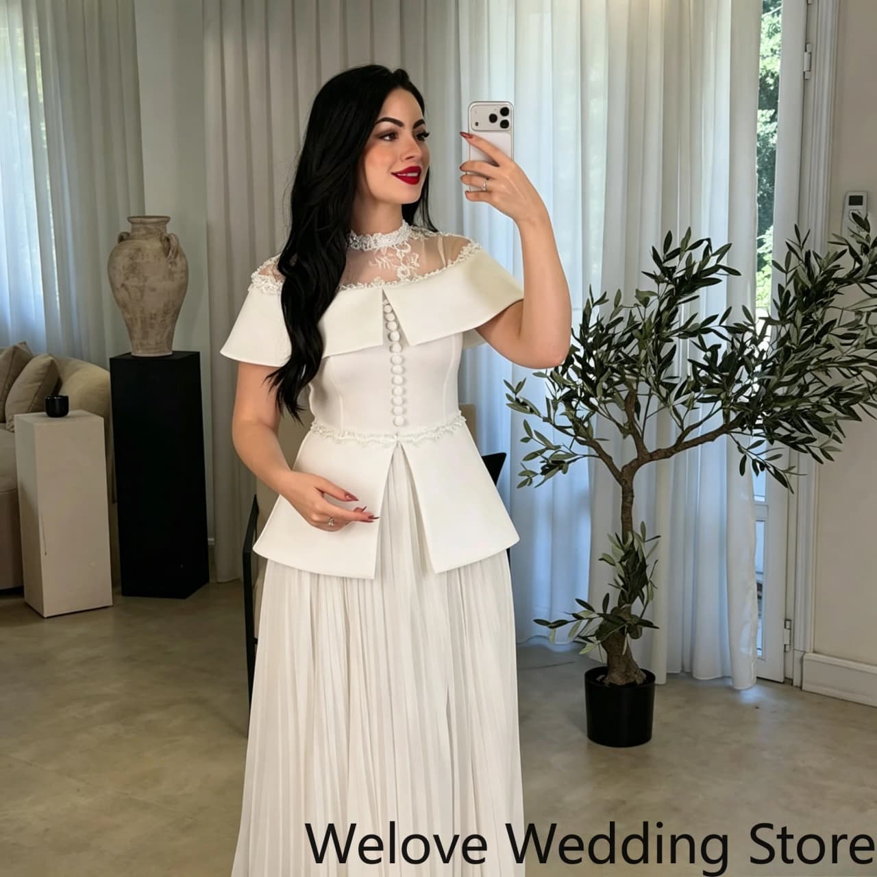 Elegant White Formal Evening Gown featuring a delicate lace high neckline a structured capelet-style top with pearl detailing