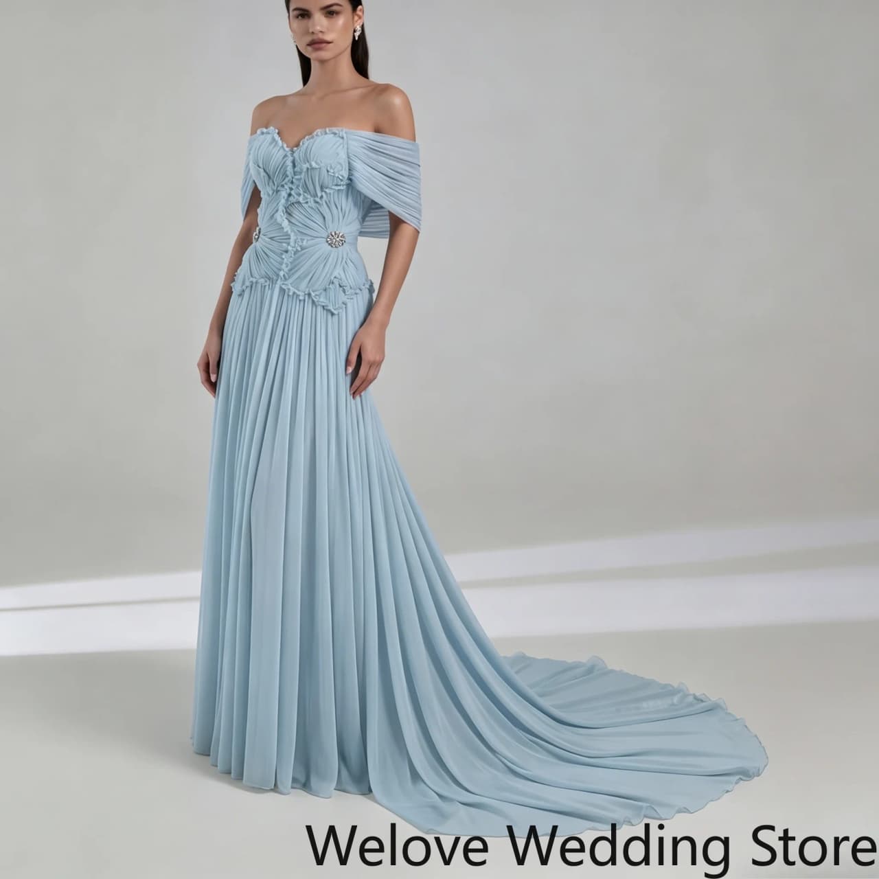 Light Blue Formal Evening Gown featuring off-the-shoulder draped sleeves ruched corset bodice decorated with crystal ornament