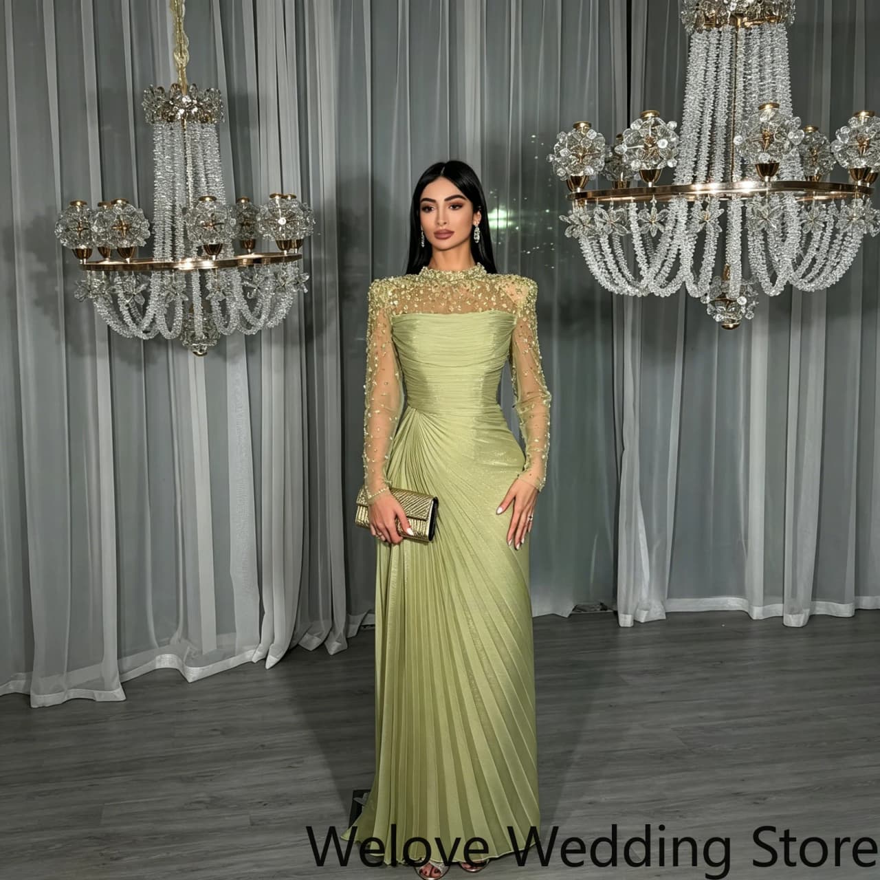 Sage‑Green Formal Evening Gown Featuring High Neckline Sheer Long Sleeves With Intricate Beaded Detail Ruched Pleated Bodice