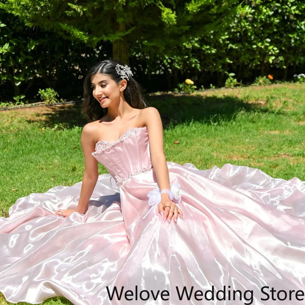 Romantic Blush Pink Formal Ball Gown featuring strapless sweetheart neckline structured corset bodice with delicate beaded trim