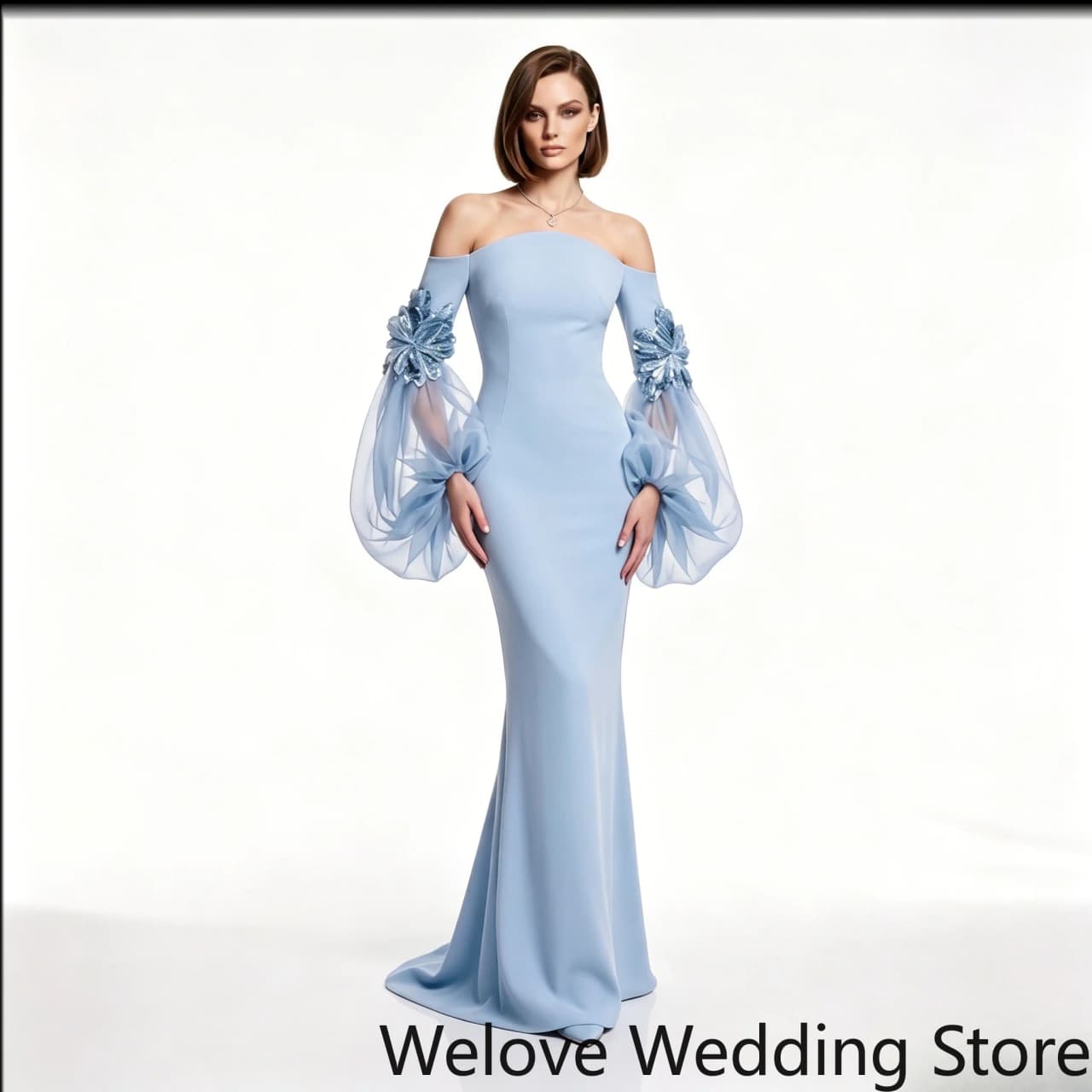 Evening Gown Featuring an Off-the-Shoulder Neckline Form-fitting Mermaid Silhouette Dramatic Puff Tulle Sleeves Floral Appliqué